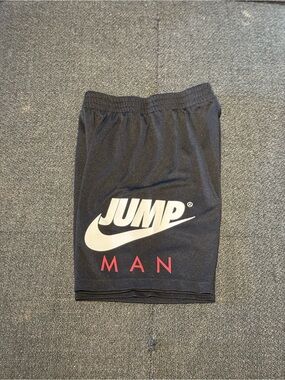 Nike Jump Man Black Athletic Shorts with White Logo and Red Lettering
